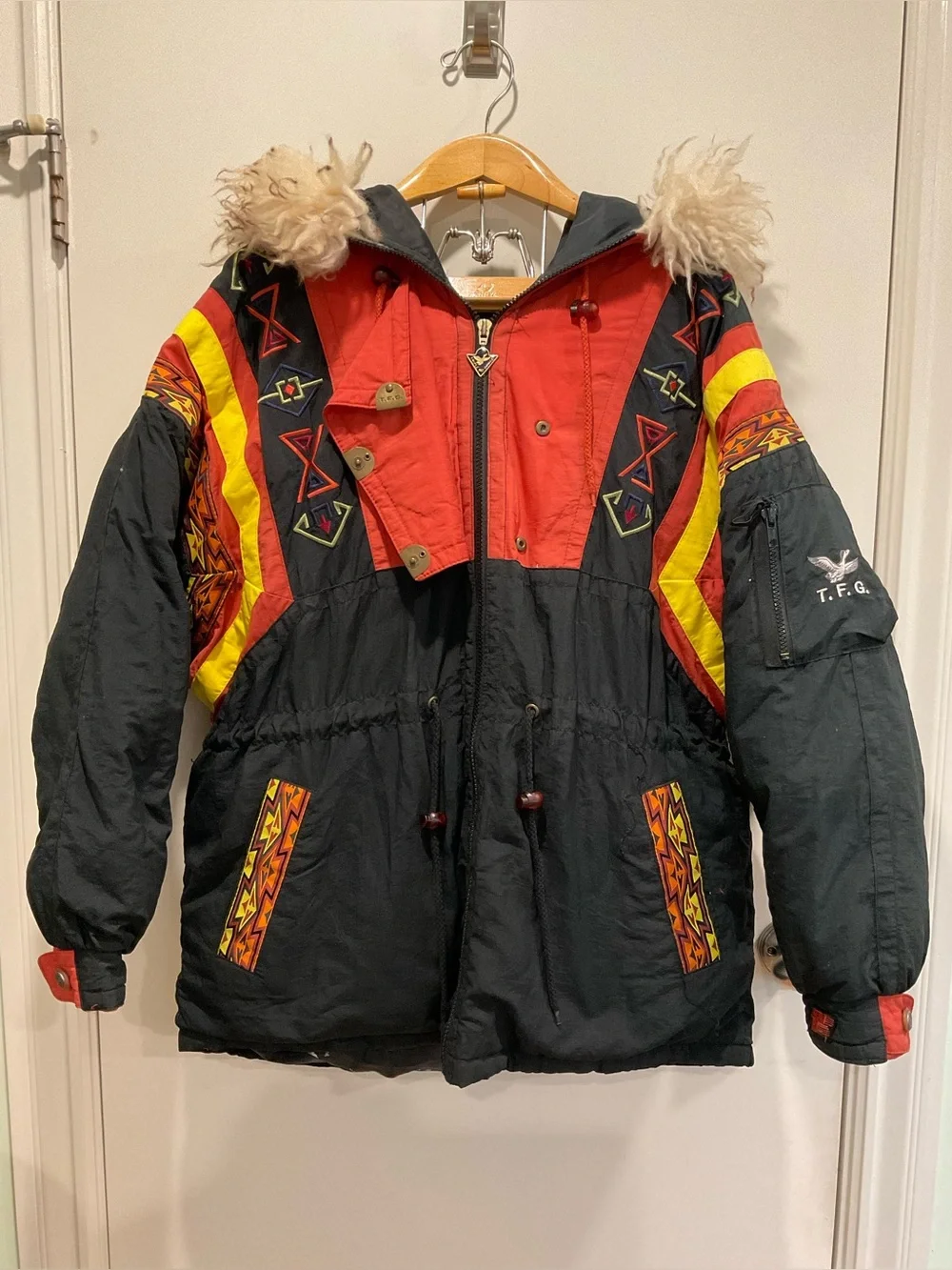 This vintage Triple F.A.T. Goose duck down ski parka features a striking.